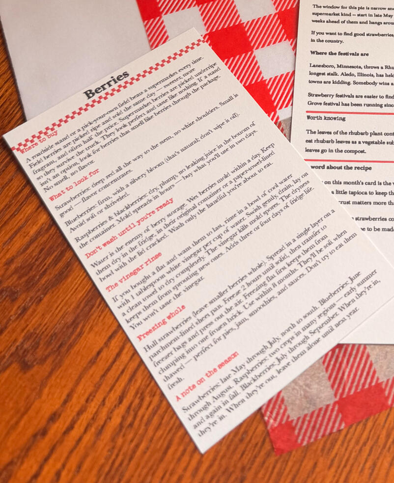 A photo of the mail club content splayed on a butcher block counter top.